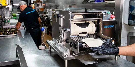 Tortilla machine in restaurant kitchen